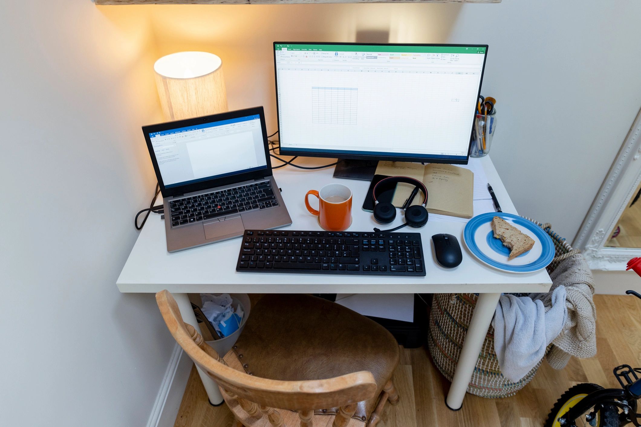 Desk workspace with dual monitors for organizing digital files