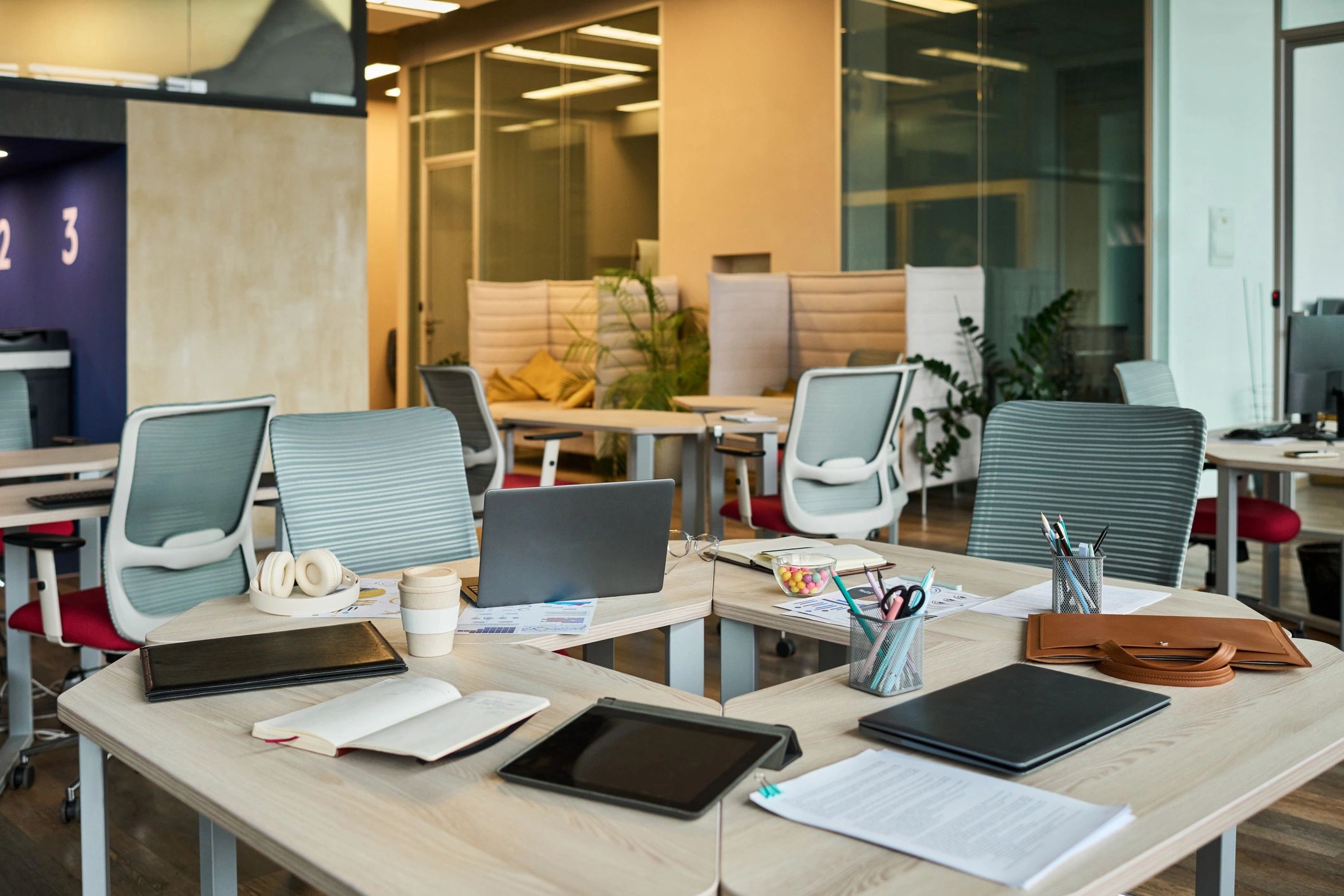 Workspace with documents and laptops representing file preparation for AI